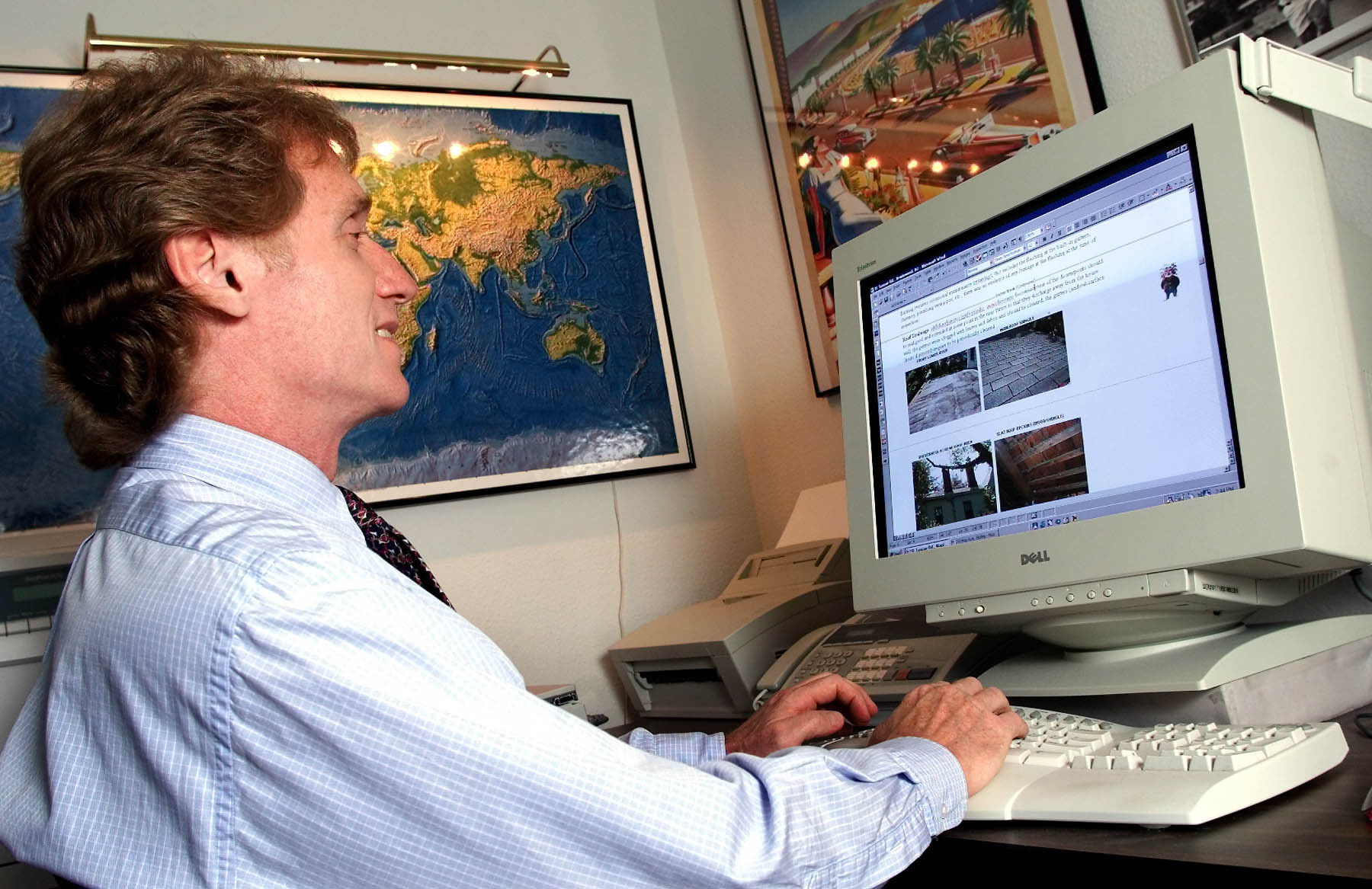 John H. Moss, the owner of Inspex Building Inspections, in his home office in Jersey City